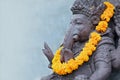 Ganesha sitting in meditating yoga pose in hindu temple