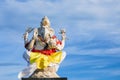 Ganesha sitting in meditating yoga pose in hindu temple