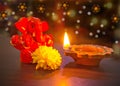 Ganesha ( Ganapathi ) Idol with Diya and Flower