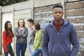 Gang Of Teenagers Hanging Out In Urban Environment Royalty Free Stock Photo