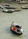 Ganges Delta, Bangladesh: A group of men on a small boat on the river in the Ganges Delta