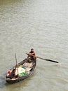 Ganges Delta, Bangladesh: A small fishing boat being rowed on the river in the Ganges Delta