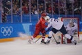 Team United States in white in action against Team Olympic Athlete from Russia Men`s ice hockey preliminary round game Royalty Free Stock Photo