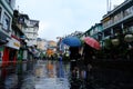 Gangtok, India - June 17, 2022: People walking in the MG Marg street carrying umbrellas during rainy season
