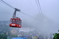 Gangtok, Sikkim - June 16 2022, Tourists enjoy a ropeway cable car ride over Gangtok city. Amazing aerial cityscape of Sikkim.