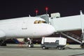 Gangway attached to the aircraft at night, apron Royalty Free Stock Photo