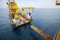 Gangway between barge and oil and gas platform, worker walked passed the way for work on the platform Royalty Free Stock Photo