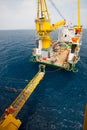 Gangway between barge and oil and gas platform, worker walked passed the way for work on the platform Royalty Free Stock Photo