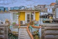 Gangway to a romantic houseboat with flowers on the porch