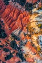 Gant, Hungary - Aerial horizontal drone view of abandoned bauxite mine with warm red and orange colors at sunset