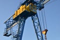 Gantry crane with hook for lifting and moving heavy cruz. Construction site. Royalty Free Stock Photo