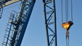 Gantry crane with hook for lifting and moving heavy cruz. Construction site. Royalty Free Stock Photo