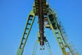 Gantry crane with hook for lifting and moving heavy cruz. Construction site. Royalty Free Stock Photo