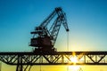 Gantry crane reloader at sunset Royalty Free Stock Photo