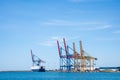 Gantry cranes background with copy space. Seascape of dock with container cranes