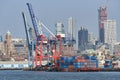 Gantry cranes in Red Hook, Brooklyn, NYC, seen against the skyline of Downtown Brooklyn Royalty Free Stock Photo