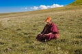 GANZI TIBETAN SICHUAN CHINA -AUGUST-19-2016 :Tibetan monkLama sits on the hill and meditation