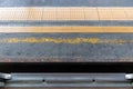 The gap between the carriage and the train platform at the station with yellow guiding block brick Royalty Free Stock Photo