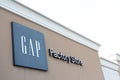 tor, canada - august 17, 2023: gap factory store outlet building clothing apparel logo sign on front of store 225 p 17