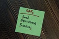 GAPs - Good Agricultural Practices write on a book isolated isolated on Wooden Table