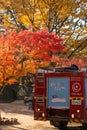 Gapyeong,South Korea-October 2020: Korean red fire truck car at the forest full of red autumn foliage trees in Nami Island, South