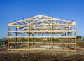 Garage construction in suburbia, USA. Wood, wooden roof truss system. Suburban building.