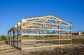 Garage construction in suburbia, USA. Wood, wooden roof truss system. Suburban building.