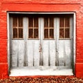 Garage door in an alley in autumn