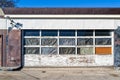 The garage door on the front of a defunct gas station