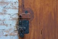 Garage door lock with rusty door Combination of screw and padlock Royalty Free Stock Photo