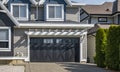 Garage Door. Modern house with garage door that is closed. A perfect neighbourhood. Family house with wide garage door Royalty Free Stock Photo