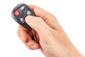 Garage door remote control in the man`s hand on a white background