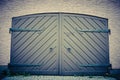 Garage door in retro vintage colors. Double sided doors of modern garage in a building.