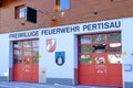 garage fire station building with red doors volunteer fire brigade in Austria, volunteering concept, fire fighting and community
