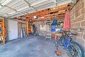 Garage interior with garden tools and two bicycles Royalty Free Stock Photo