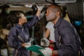 Garage mechanic team working car auto service black african people professional worker together Royalty Free Stock Photo