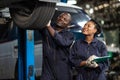 Garage mechanic team working car auto service black african people professional worker together Royalty Free Stock Photo