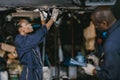 Garage mechanic woman team working car auto service black african people professional worker together Royalty Free Stock Photo