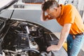 Garage mechanic worker stress with problem car engine fail Royalty Free Stock Photo
