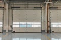 Garage rolling door in a new car workshop with resin floor