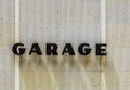 Garage sign at house facade