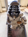 In the garage there is an opened engine block of a car Royalty Free Stock Photo