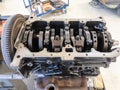 In the garage there is an opened engine block of a car Royalty Free Stock Photo