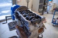 In the garage there is an opened engine block of a car Royalty Free Stock Photo