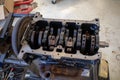 In the garage there is an opened engine block of a car Royalty Free Stock Photo