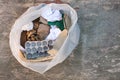 Garbage bag with different paper trash. Garbage sorting Royalty Free Stock Photo