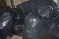 Garbage bags. Cleaning of the territory. Large black plastic bags with household waste Royalty Free Stock Photo