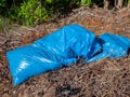 Garbage bags in the forest pollution