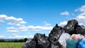 Garbage bags large pile, plastic garbage waste big stack, lot of waste bag and sky background, copy space