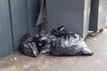 Garbage bags near trash can Royalty Free Stock Photo